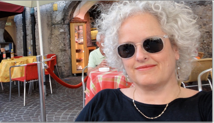 woman sitting on patio sunglasses photo