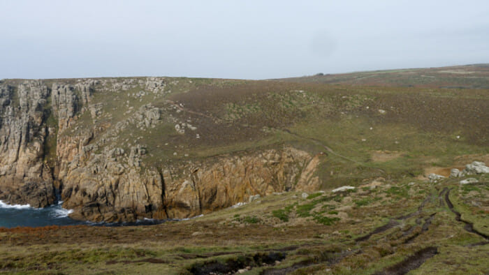 Can you see the path on right and it continue past the cove. There is a climb down first and a climb up the other side before getting to the path you can see.