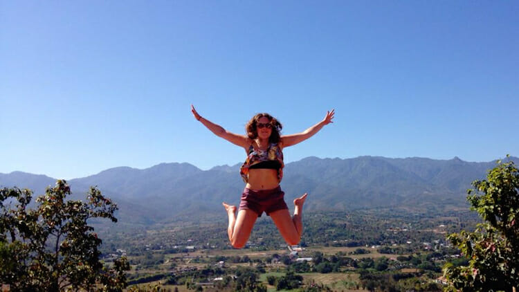 solo traveler leaping in the air