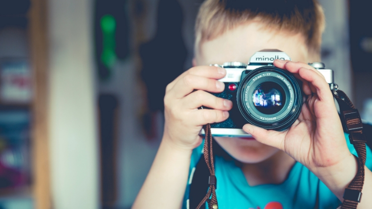child with camera