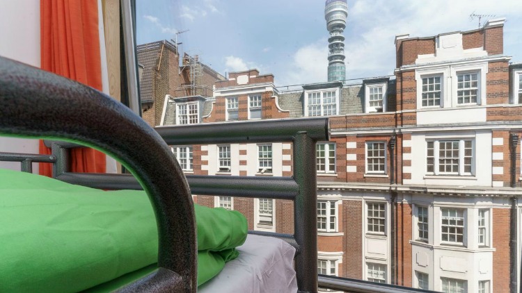 View of London from hostel bunk bed, another accommodation option for solo travelers.