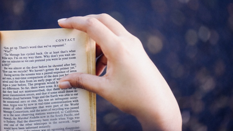 book, hand, choosing a travel destination