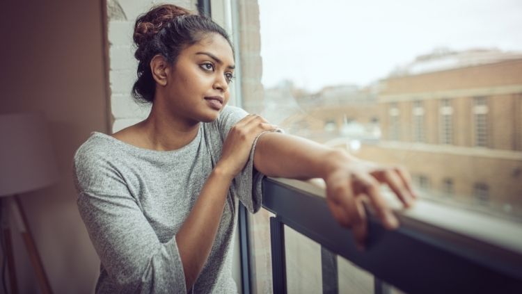 woman gazing out window