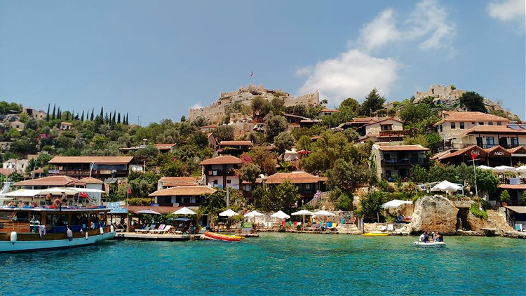 the village of Kaleköy from the water during solo travel to Kaş