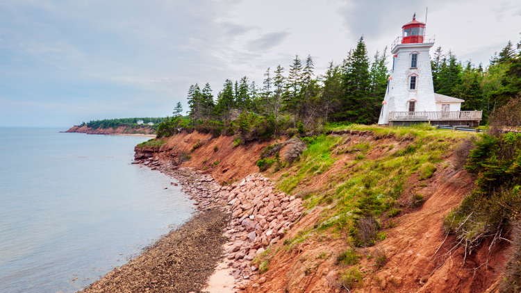 An iconic lighthouse on Prince Edward Island is a sight not to be missed when you travel solo in Canada.