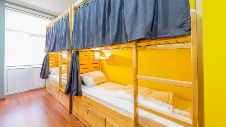 the hostel experience - dorm with privacy curtains