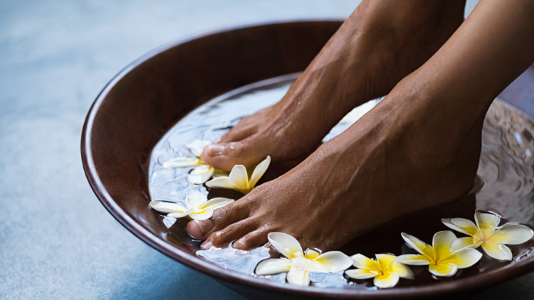 pampering, as shown in this photo of a footbath with flowers, can be part of going to a resort alone