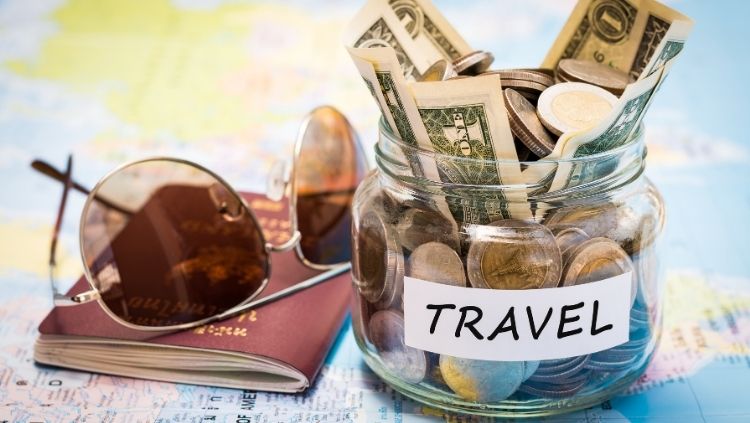 sunglasses, passport and jar of cash