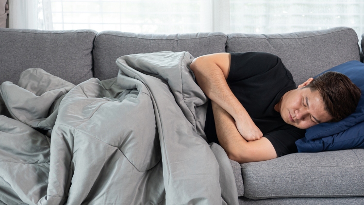 man sleeping on sofa