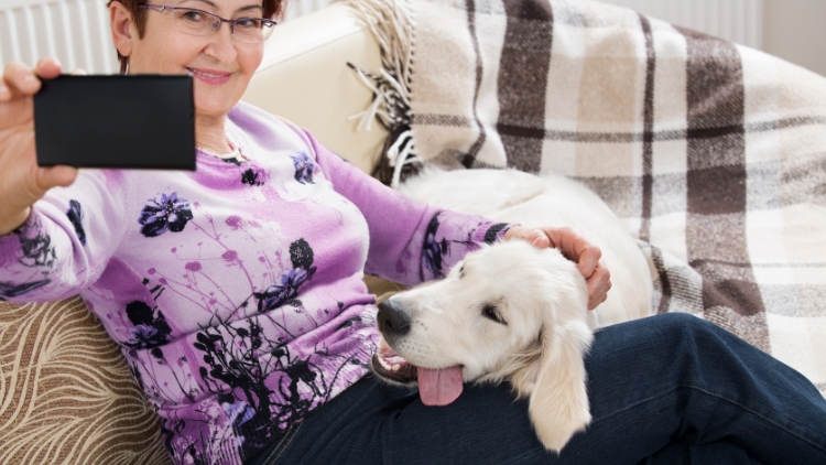 woman taking selfie with dog