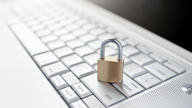 Photo of a lock sitting on a keyboard