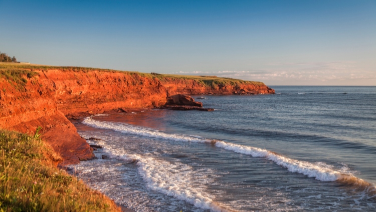 When you travel solo in Canada, you can see this red earth in PEI