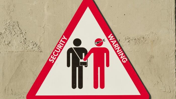 security warning sign. If you see this, you need to know how to avoid pickpockets.