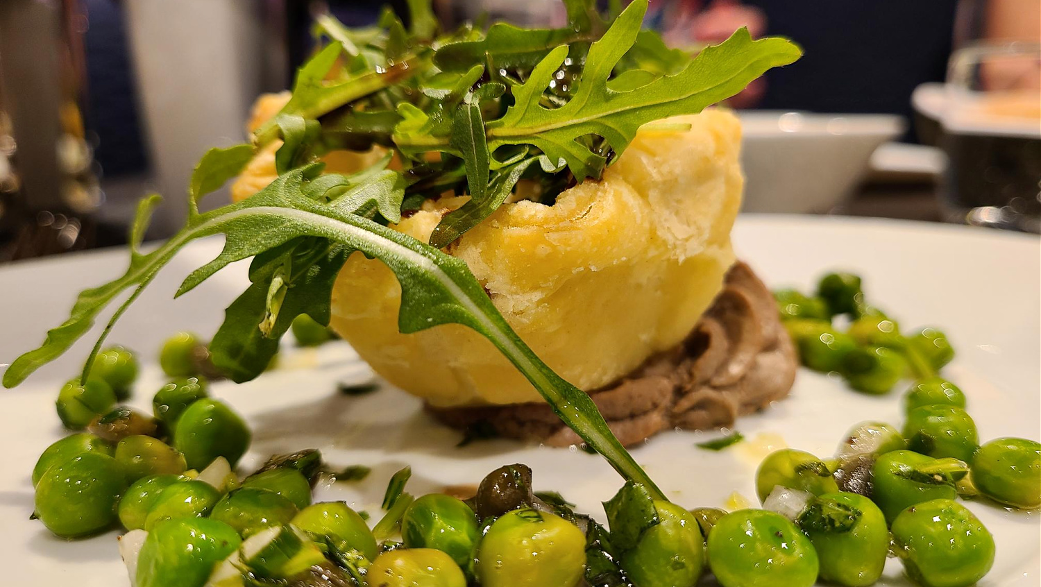 a delicious savory tart at dinner on a river cruise