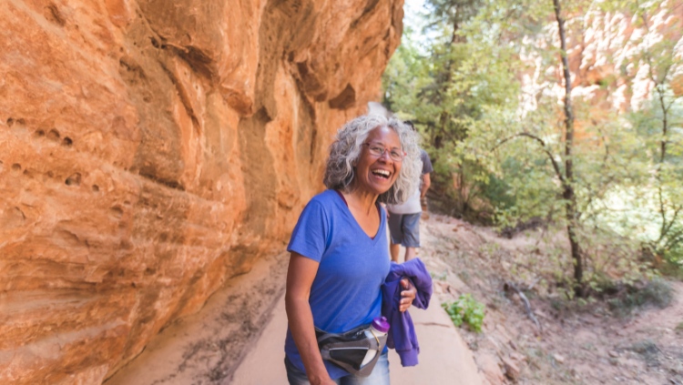 female solo traveler over 50 hiking