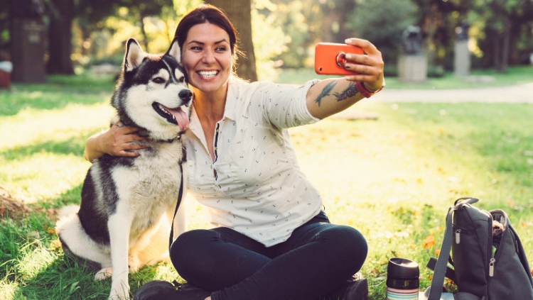 woman taking selfie with dog