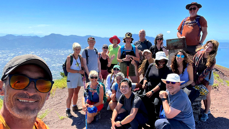 group photo top of mount vesuvius on an amalfi coast walking tour