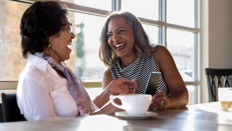 two women chatting in cafe