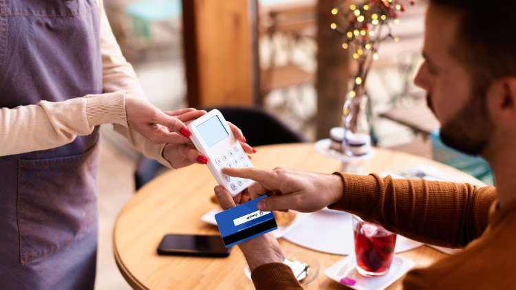 man paying bill in restaurant