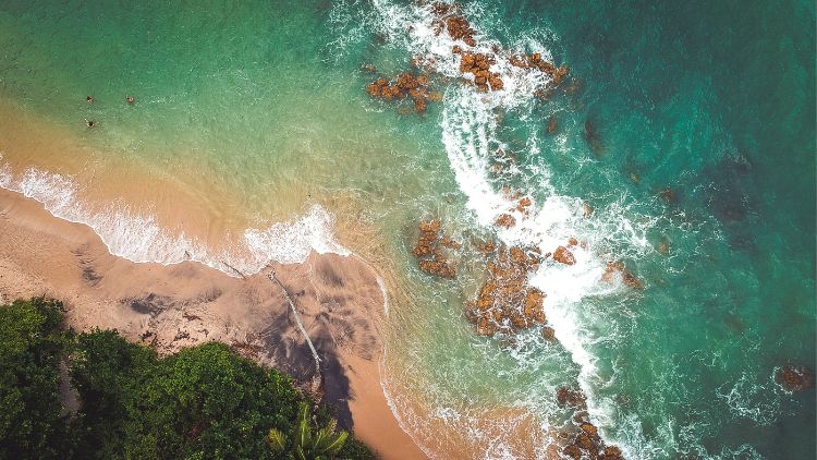 aerial shot of a secluded beach, ideal for a solo beach vacation