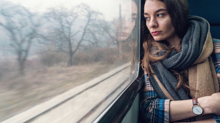 Some people hate traveling alone, like this unhappy woman on a train.
