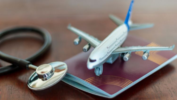 toy plane, passport and stethoscope