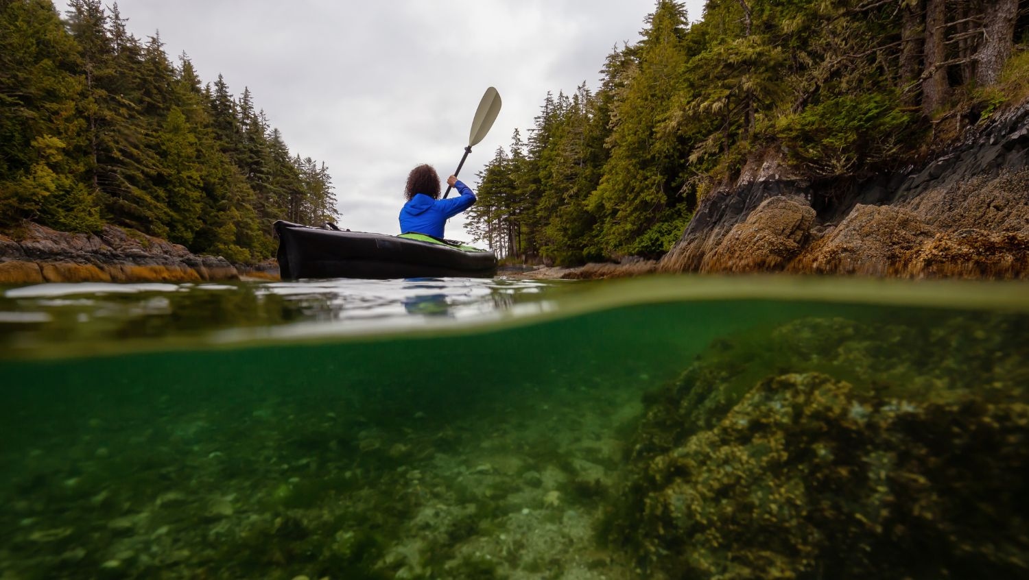 Woman kayaking near Port Hardy on a solo trip to Vancouver Island