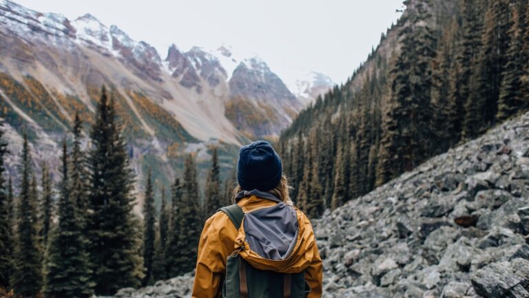 woman with backpack in mountains